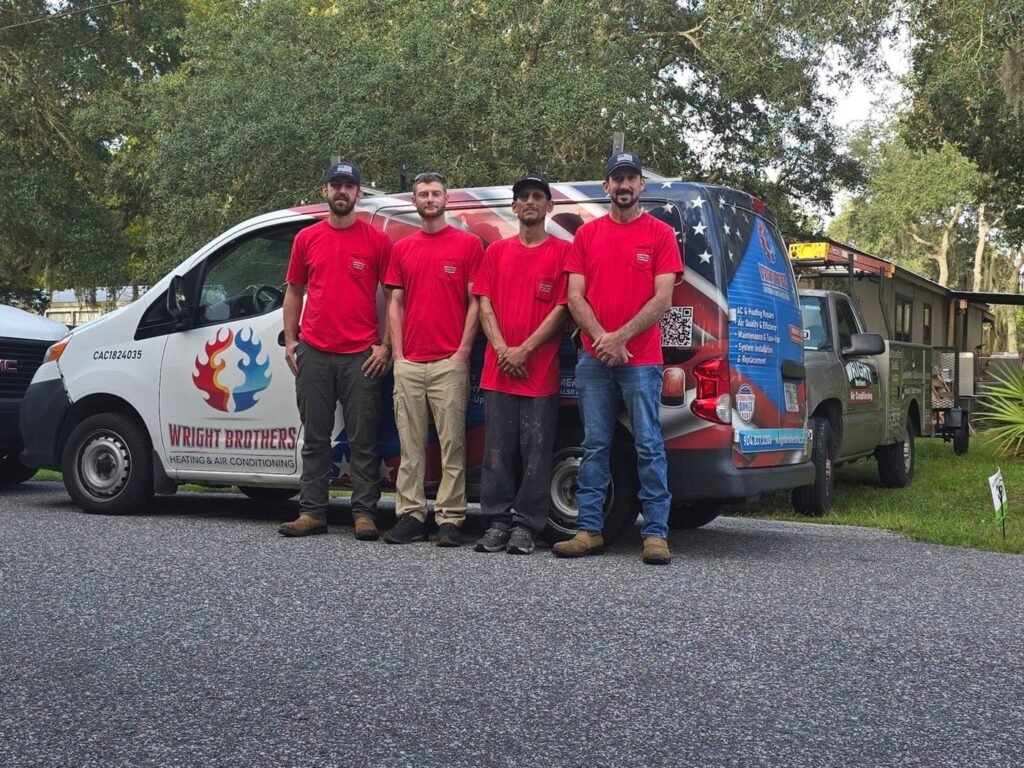 Wright Brothers Heating & Air Conditioning technicians with their service van in St. Augustine, FL.